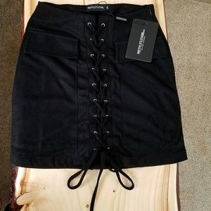 Black faux suede mini skirt.